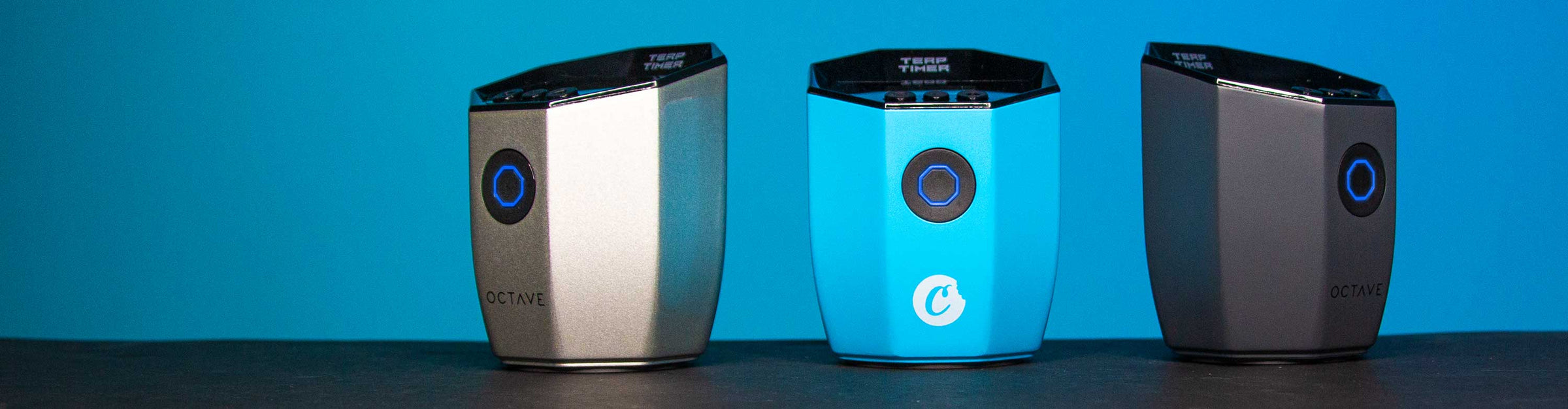 Octave Terp Timers standing on black table with blue background