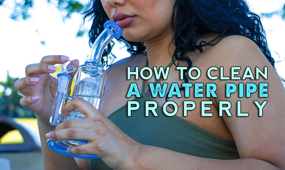 woman holding a water pipe outside at park with text